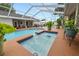Inviting pool area with a spa and screened enclosure, perfect for relaxation and entertainment at 1130 Ewell Rd, Lakeland, FL 33811