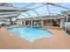 Sparkling pool with an attached spa and outdoor bar, creating a luxurious backyard retreat at 1130 Ewell Rd, Lakeland, FL 33811