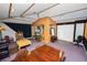 Room with a central wooden structure, and a purple carpet at 1130 Ewell Rd, Lakeland, FL 33811