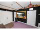 Cozy room with vintage decorations, a black wall, and a purple carpet at 1130 Ewell Rd, Lakeland, FL 33811