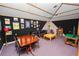 Well-decorated room with a vintage vibe, a sofa, and framed photos on the wall at 1130 Ewell Rd, Lakeland, FL 33811
