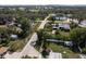 Overhead view showcases a charming neighborhood street surrounded by lush green trees and well-maintained homes at 1195 S 1St Ave, Bartow, FL 33830