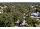 Aerial view of a residential street shaded by mature trees, showcasing a serene neighborhood at 1195 S 1St Ave, Bartow, FL 33830