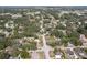 Drone photo shows a charming neighborhood with mature trees lining the streets and homes at 1195 S 1St Ave, Bartow, FL 33830