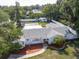 An aerial view showcases this beautiful home and surrounding greenery at 1195 S 1St Ave, Bartow, FL 33830