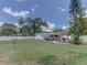 Large backyard featuring covered parking and outdoor kitchen at 1195 S 1St Ave, Bartow, FL 33830