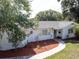 Charming single-story home with a well-maintained lawn and mature trees at 1195 S 1St Ave, Bartow, FL 33830