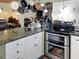 Bright kitchen featuring granite countertops, a double oven, and hanging pot rack at 1195 S 1St Ave, Bartow, FL 33830
