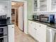 Well-lit kitchen with stainless steel appliances and plenty of cabinet storage at 1195 S 1St Ave, Bartow, FL 33830