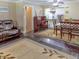 Cozy open floorplan featuring a dining room and living area with lovely area rugs at 1195 S 1St Ave, Bartow, FL 33830