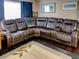 Spacious living room featuring a comfortable leather sofa, hardwood floors and natural light at 1195 S 1St Ave, Bartow, FL 33830