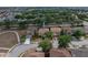 Aerial view of the house situated among mature trees at 143 Alfani St, Davenport, FL 33896
