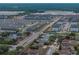 Wide aerial view of the residential community and commercial district at 143 Alfani St, Davenport, FL 33896
