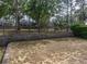 Backyard features a retaining wall and wrought iron fence at 143 Alfani St, Davenport, FL 33896