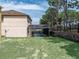 Backyard view of the home featuring a screened pool at 143 Alfani St, Davenport, FL 33896