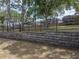 Backyard features a retaining wall and wrought iron fence at 143 Alfani St, Davenport, FL 33896