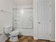 Cozy bathroom with a tub and shower combination and sliding glass door at 143 Alfani St, Davenport, FL 33896
