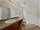 Bathroom with tiled floor, vanity and shower-tub combo at 143 Alfani St, Davenport, FL 33896