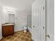 Bathroom featuring tile floors, vanity and shower with glass doors at 143 Alfani St, Davenport, FL 33896