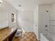 Bathroom featuring shower-tub combo, vanity and tiled flooring at 143 Alfani St, Davenport, FL 33896
