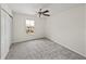 Bedroom featuring carpeting, closet, ceiling fan, and window with a view at 143 Alfani St, Davenport, FL 33896