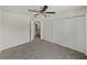 Bedroom featuring carpet flooring, ceiling fan, and closet at 143 Alfani St, Davenport, FL 33896