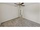 Bedroom with carpeting, ceiling fan, and open doorway at 143 Alfani St, Davenport, FL 33896