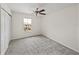 Bright bedroom with a ceiling fan, neutral carpet, and a window at 143 Alfani St, Davenport, FL 33896