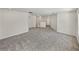 Neutral-carpeted bonus room area with doorways to other rooms at 143 Alfani St, Davenport, FL 33896