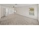 Bonus room with ceiling fan, carpet and windows at 143 Alfani St, Davenport, FL 33896