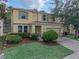 Inviting two-story home with a well-manicured lawn and charming green shutters at 143 Alfani St, Davenport, FL 33896