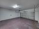 Spacious two-car garage with overhead door and ample space for storage and parking at 143 Alfani St, Davenport, FL 33896