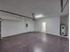 Garage featuring concrete floors, an automatic garage door, and access to a utility area at 143 Alfani St, Davenport, FL 33896