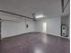 Large two-car garage with modern door opener, door to inside, and water heater at 143 Alfani St, Davenport, FL 33896