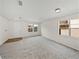 Bright, carpeted living room with multiple windows at 143 Alfani St, Davenport, FL 33896