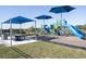 Community playground featuring colorful play structures, picnic tables, and shaded areas for Gathering fun at 1444 Fleur Dr, Davenport, FL 33837