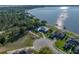 Stunning aerial view of lakeside homes with private docks and lush green landscaping at 148 Melissa Trl, Auburndale, FL 33823
