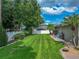 Manicured backyard featuring a brick pathway and privacy fence, ideal for outdoor enjoyment at 148 Melissa Trl, Auburndale, FL 33823