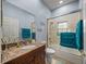 Bright bathroom with a vanity, a mirror, a glass shower enclosure, and white walls at 148 Melissa Trl, Auburndale, FL 33823