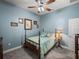 Cozy bedroom featuring blue walls, plush carpet, and comfortable-looking bed at 148 Melissa Trl, Auburndale, FL 33823