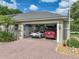 Well-organized garage showcasing two vehicles, storage solutions, and a clean, functional space at 148 Melissa Trl, Auburndale, FL 33823