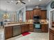 Spacious kitchen with stainless steel appliances and granite countertops, adjacent to breakfast nook at 148 Melissa Trl, Auburndale, FL 33823