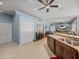 Open-concept living area with kitchen access and ample space for relaxing at 148 Melissa Trl, Auburndale, FL 33823