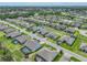 Beautiful single-Gathering home in a residential neighborhood featuring manicured lawns, mature trees, and wide, quiet streets at 1547 Cordgrass Way, Lakeland, FL 33813