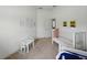 A bedroom featuring a table and chairs, a crib, and colorful artwork at 1547 Cordgrass Way, Lakeland, FL 33813