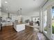 Spacious kitchen with granite counters, stainless appliances, and open floor plan at 1547 Cordgrass Way, Lakeland, FL 33813