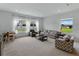 Bright living room with large windows provides abundant natural light at 1547 Cordgrass Way, Lakeland, FL 33813