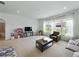 Spacious living room featuring large windows with great natural light and neutral carpet at 1547 Cordgrass Way, Lakeland, FL 33813