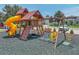 Community playground featuring swings, slide, climbing structure, and seating for parents at 1547 Cordgrass Way, Lakeland, FL 33813
