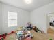 Bright playroom with carpeted floors, natural light, and space for toys and activities at 1547 Cordgrass Way, Lakeland, FL 33813